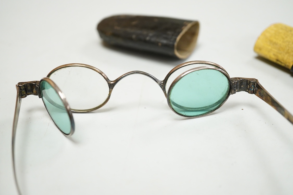 A pair of George IV silver turn pin hinged spectacles with tinted and clear double folding lenses, mm. H.I, London 1825, card case